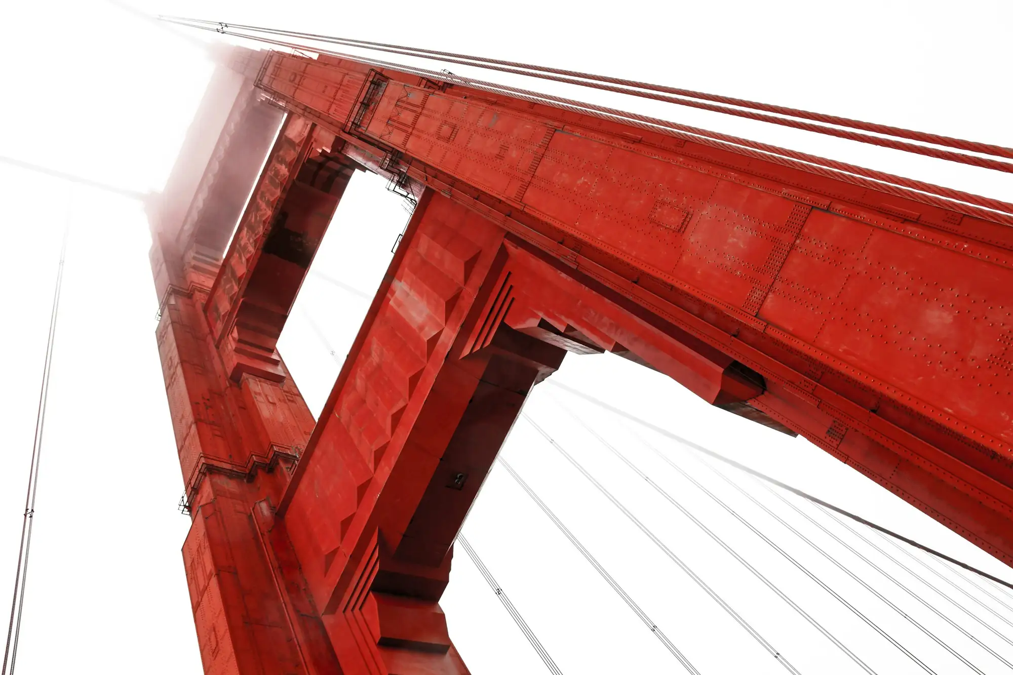 Looking up at a Golden Gate Bridge tower through the fog.